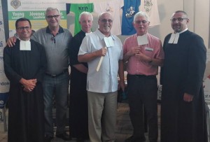 Brother Superior General Robert Schieler, FSC, center, help to promote vocations at the Institute booth. Courtesy Young Lasallians 